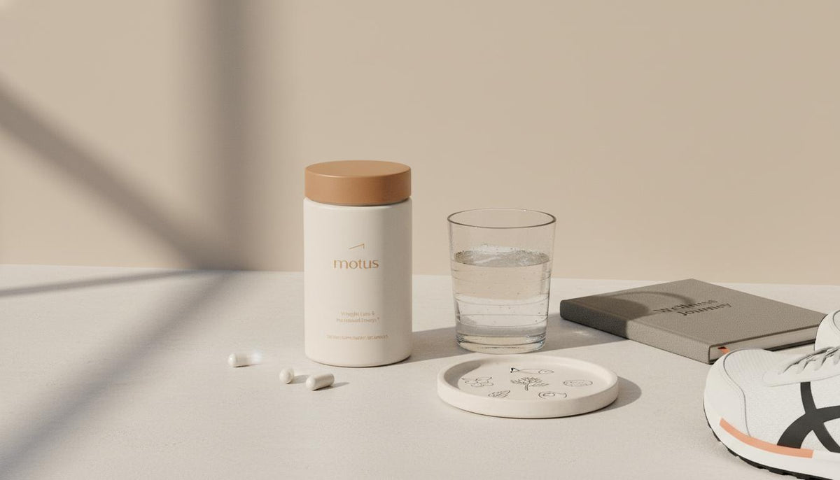 Minimalist still life of a Tonum Motus jar on a beige countertop with a glass of water, journal and running shoes, calm health-and-wellness scene — phentermine pills