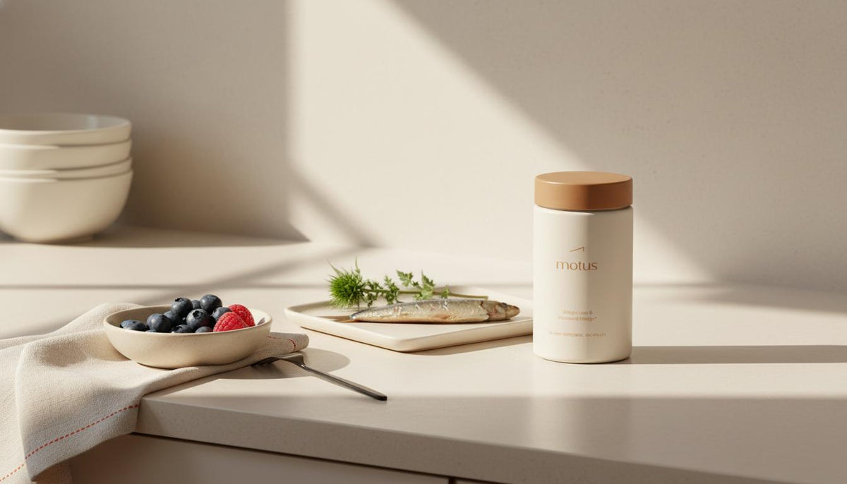 Bright minimalist kitchen scene with Tonum supplement jar and brain-supportive foods (berries, sardine fillet, milk thistle) illustrating nootropics for memory.