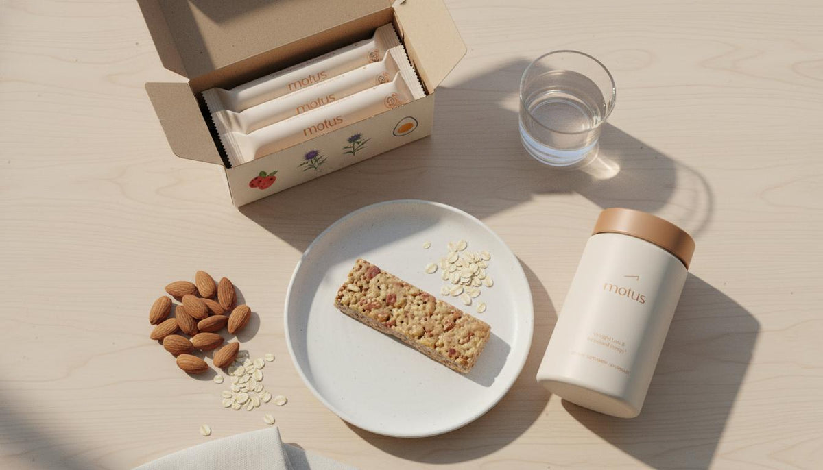 Overhead still-life of an opened protein bar box with an unwrapped bar on a white plate, almonds, oats and a glass of water, subtle Tonum decals — how to choose the right protein bar