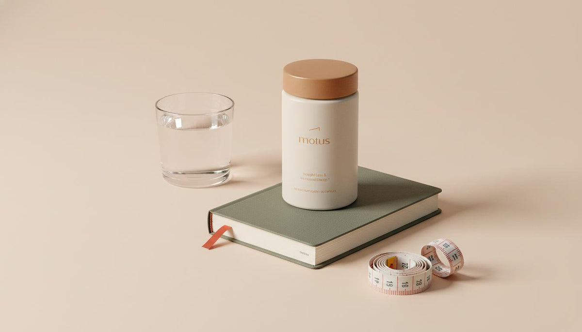 Minimalist flat-lay of Tonum Motus supplement next to a glass of water, folded journal and measuring tape on pale beige background, suggesting alpha lipoic acid weight loss support.