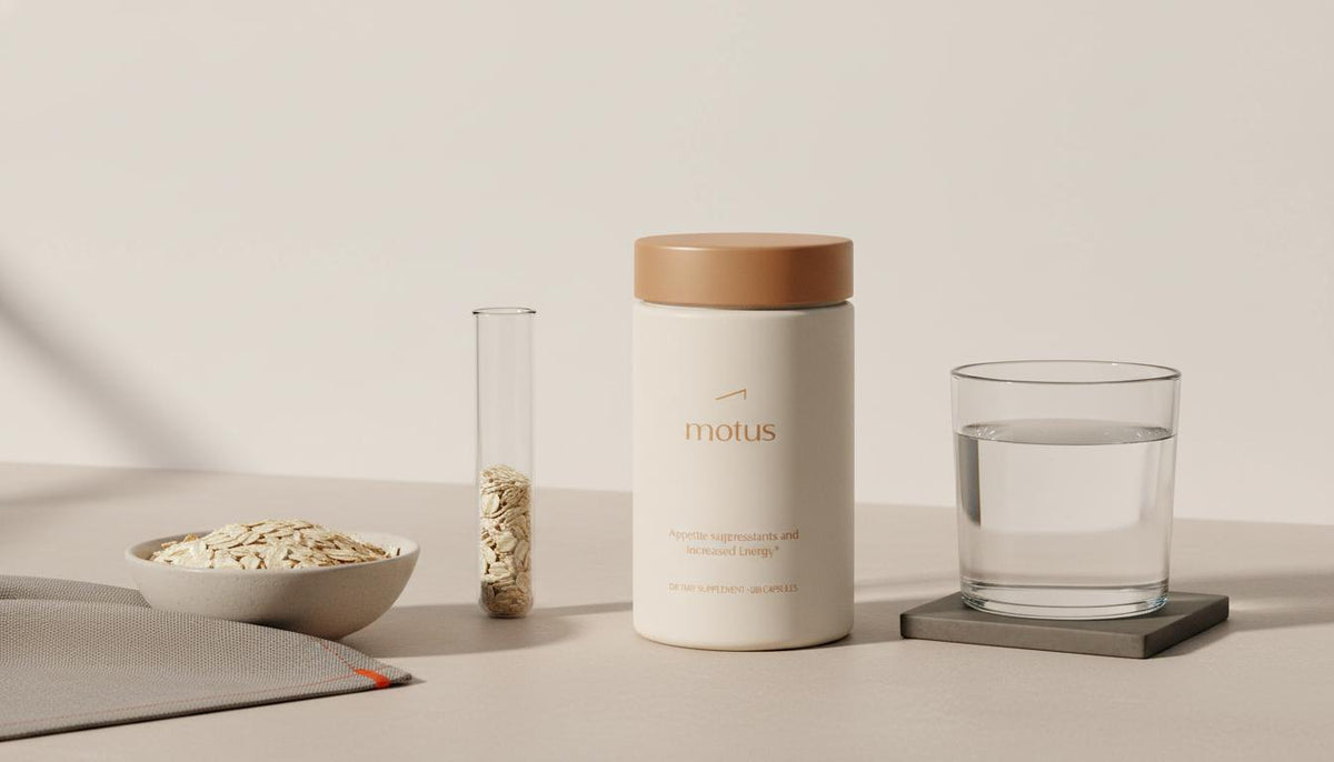 Minimalist full-frame photo of Tonum Motus container beside bowl of oats, glass of water and test tube of oats, suggesting appetite suppressants and research-backed nutrition