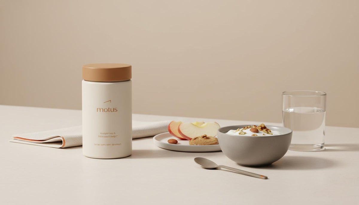 Minimal still-life of Tonum Motus supplement beside sliced apple with almond butter, Greek yogurt and water on a beige counter illustrating B12 deficiency cravings