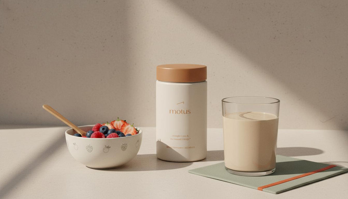 Minimalist kitchen counter with a Tonum Motus jar next to a prepared protein shake, bowl of mixed berries and wooden spoon — best protein shake for weight loss