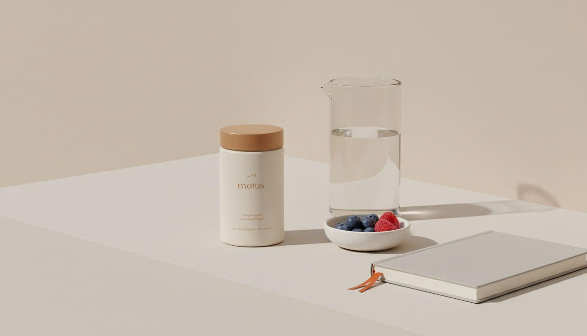 Minimalist morning scene with Tonum Motus supplement jar beside a glass carafe, small bowl of berries and a journal on a beige table — best weight loss supplements for women