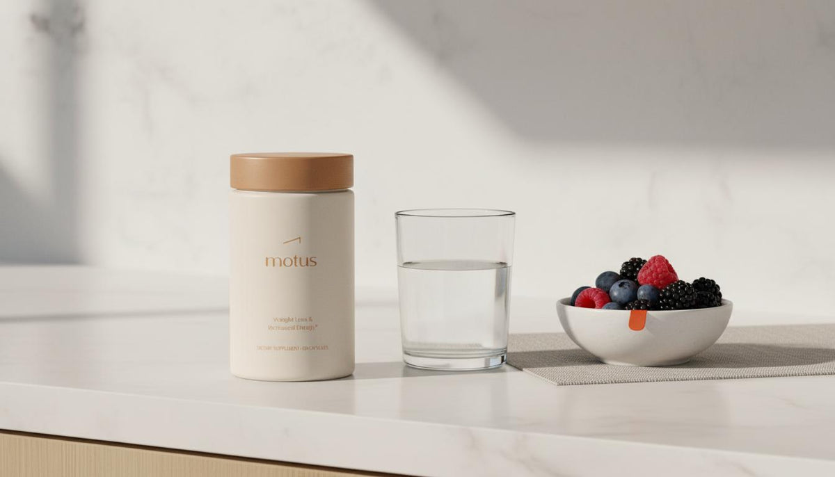 Minimal clinical kitchen still life with Tonum Motus supplement next to a glass of water and bowl of berries on a #F2E5D5 counter, research-backed liver health — can cirrhosis be reversed