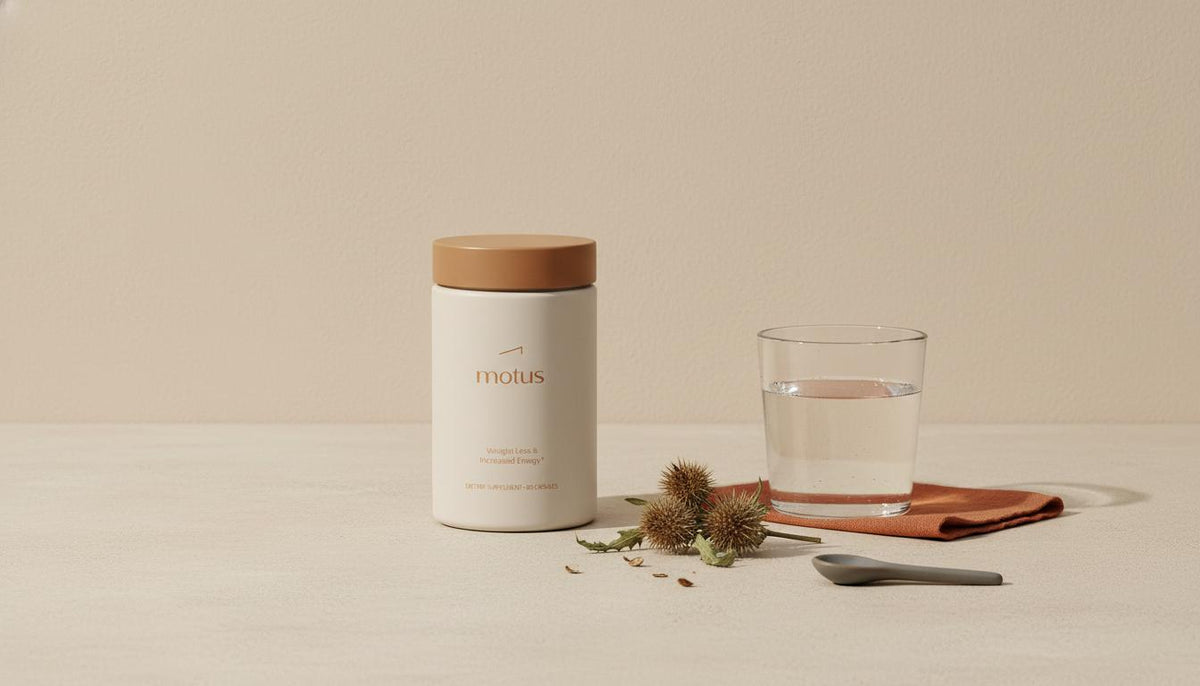 Tonum supplement jar on a minimalist kitchen counter beside milk thistle seed pods and a glass of water, illustrating does milk thistle remove liver fat