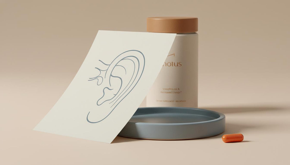 Minimalist still life of an inner ear diagram on matte paper with a Tonum supplement container partially visible on a ceramic tray, evoking dopamine dizziness