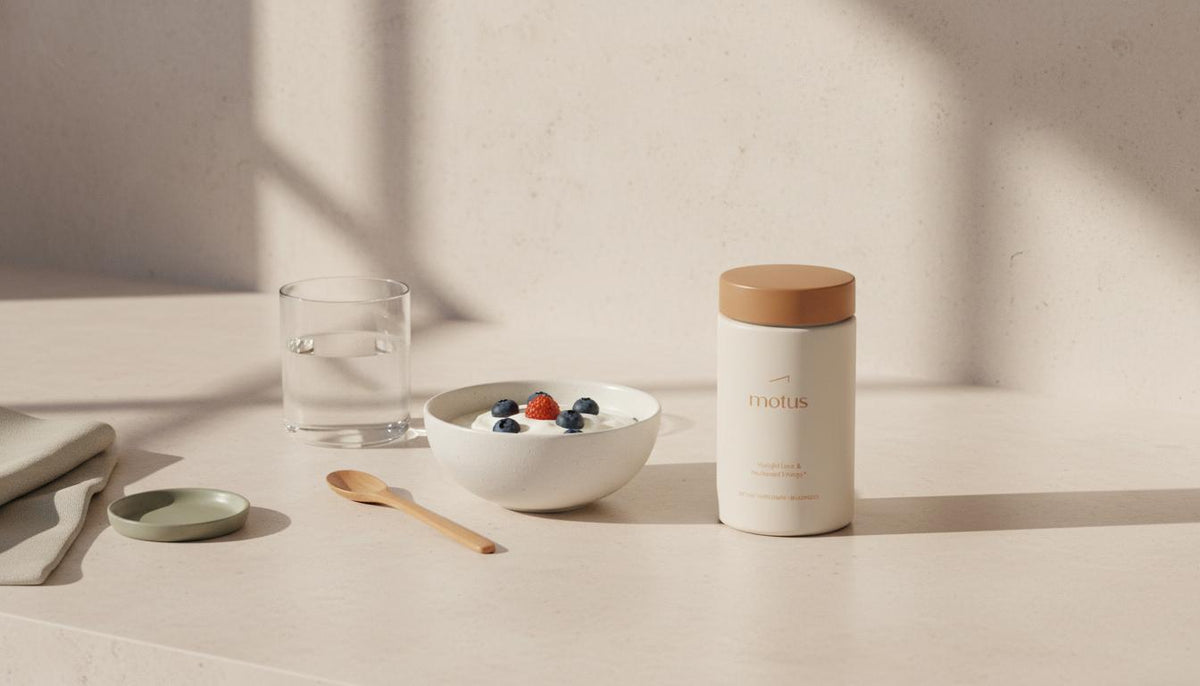 Minimalist kitchen breakfast with Tonum Motus supplement beside Greek yogurt and water, evoking daily habits to lose weight without dieting