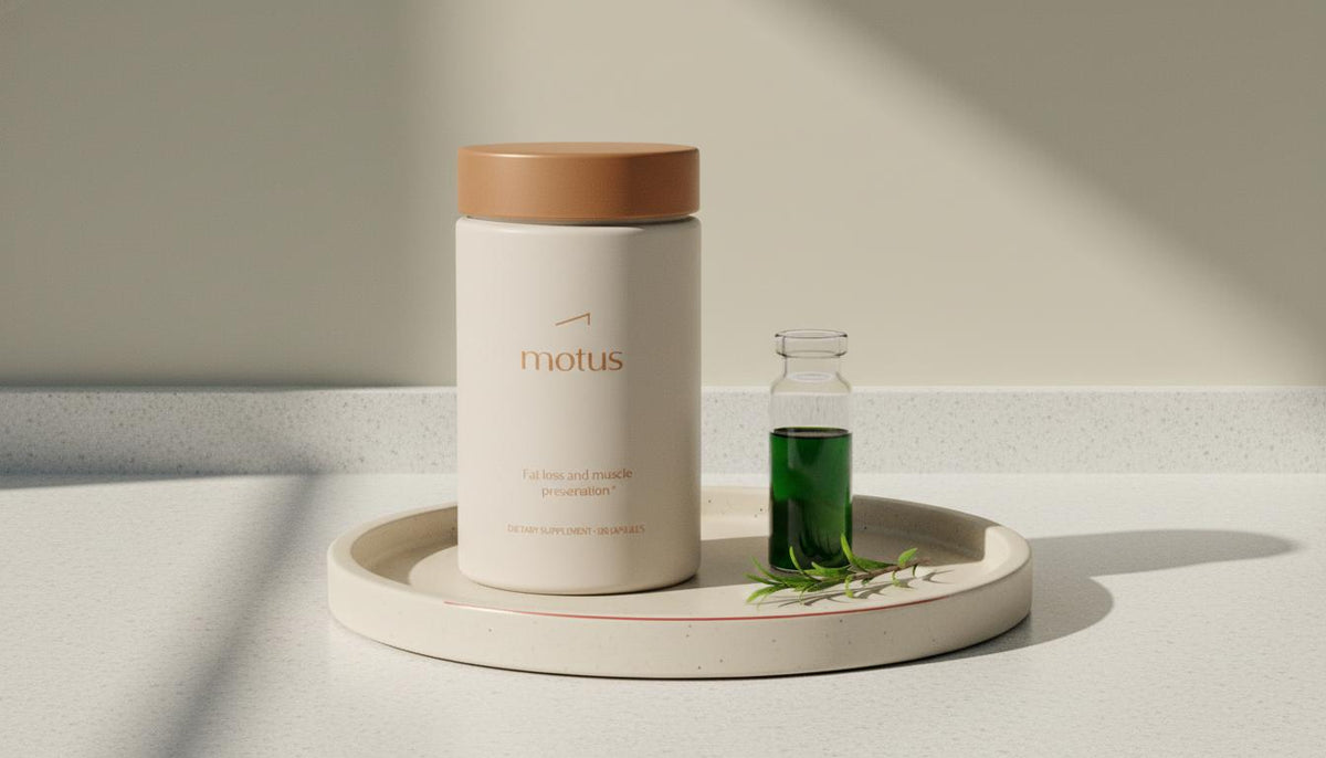 Tonum Motus supplement container on a beige ceramic tray with a lab vial and green sprig, conveying research-backed fat loss and muscle preservation.