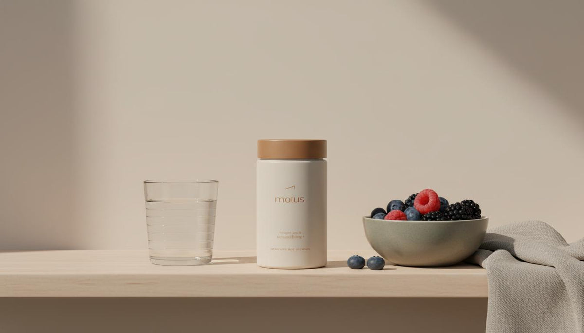 Minimalist studio photo of the Tonum supplement container on a wooden shelf with a glass of water, bowl of berries and linen napkin, conveying NAD+ and weight loss metabolic wellness.