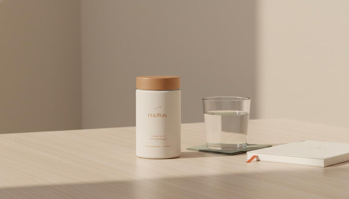 Minimalist still-life of Tonum Motus supplement jar with glass of water and notebook on a light wooden table, evoking thoughtful sustainable weight management; non prescription weight loss pill