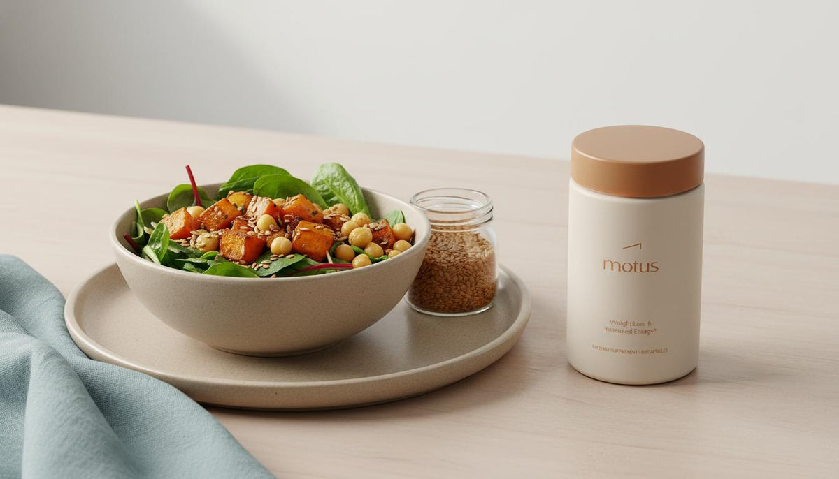 Minimalist kitchen scene with Tonum Motus beside a plate of mixed greens, roasted sweet potato, chickpeas and flaxseed, illustrating plant-based weight loss.