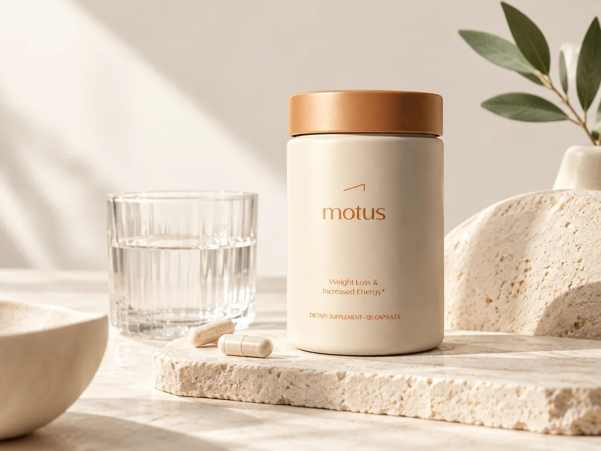Tonum MOTUS supplement bottle with capsules and a glass of water on a sunlit neutral surface.