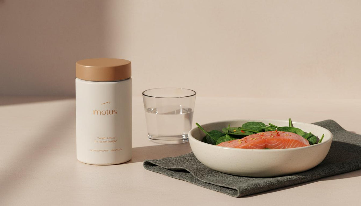 Minimalist still-life of Tonum Motus bottle with salmon and leafy greens on a #F2E5D5 counter, visual for vitamin D3 belly fat article.