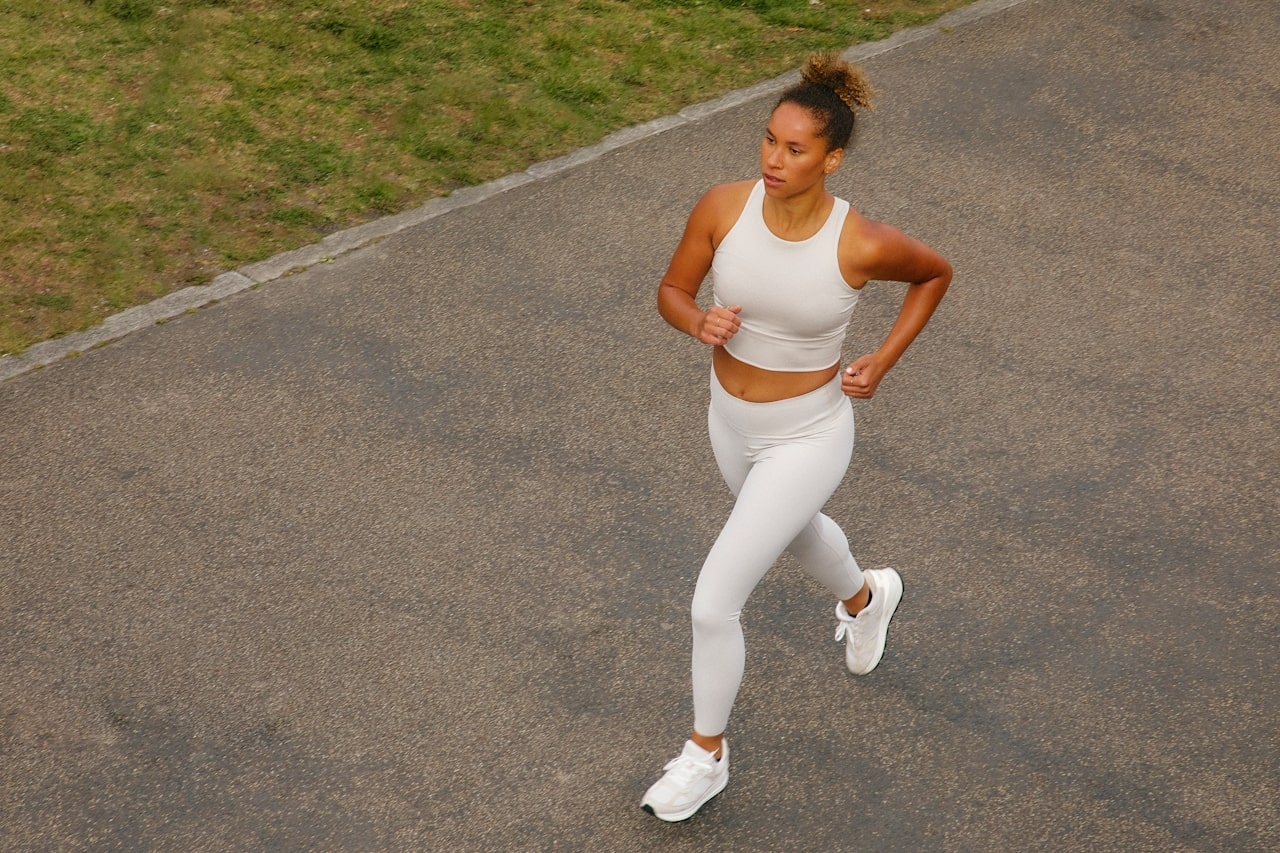 woman jogging on road