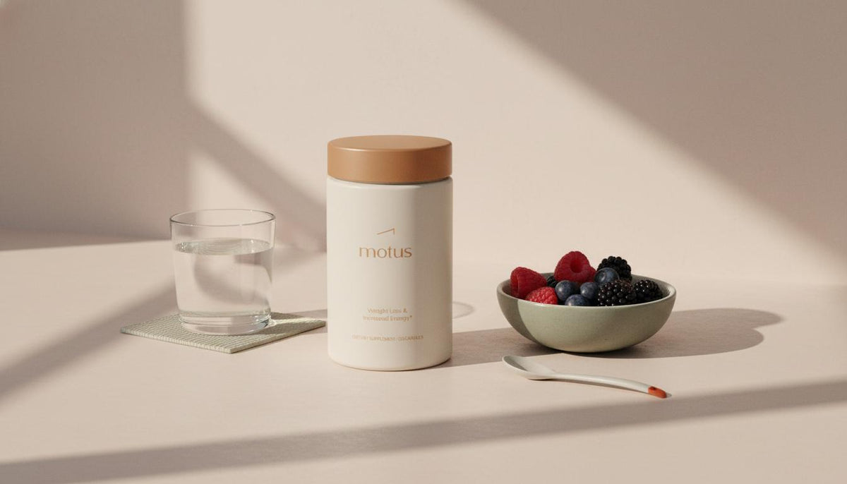 Minimalist kitchen counter with Tonum Motus supplement container beside a glass of water and a bowl of berries, soft natural light; What has been scientifically proven to lose weight?