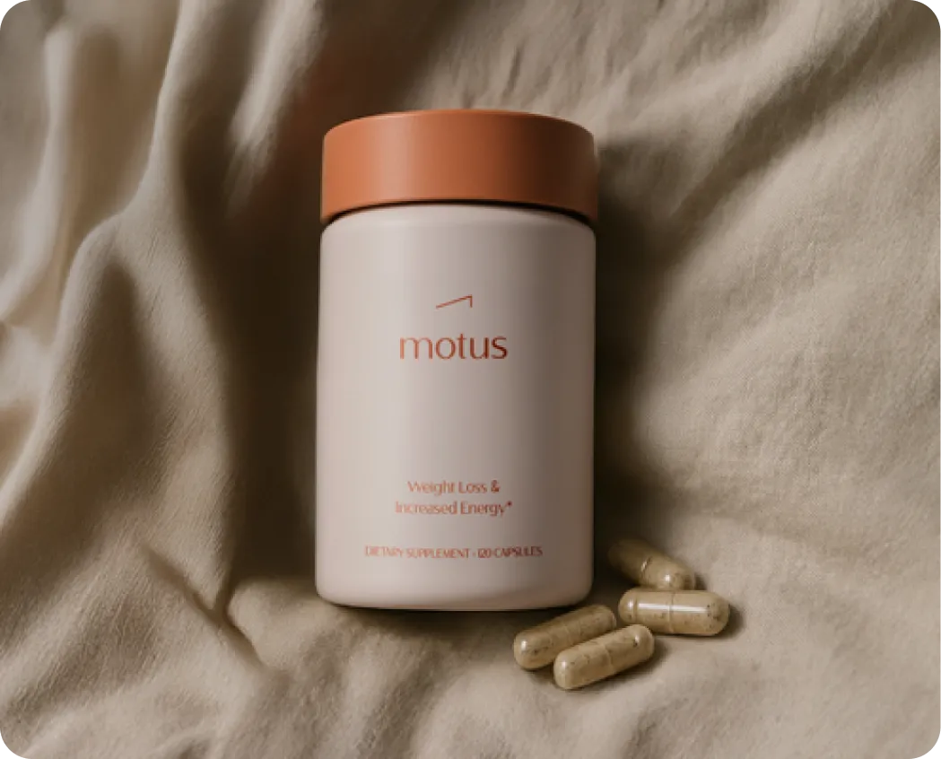 Motus bottle with capsules on linen