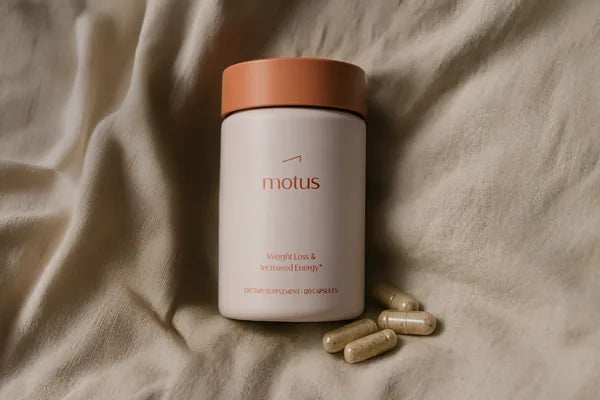 Motus supplement jar on a linen background